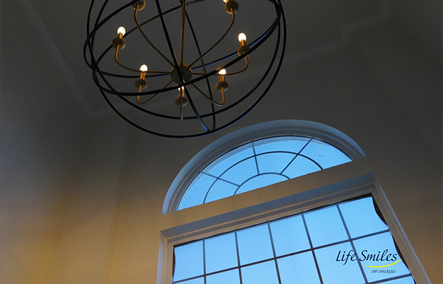 Chandelier and window inside of dental office